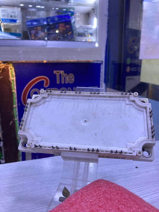 FP100R12KT4 power module displayed on clear stand at The Component Centre