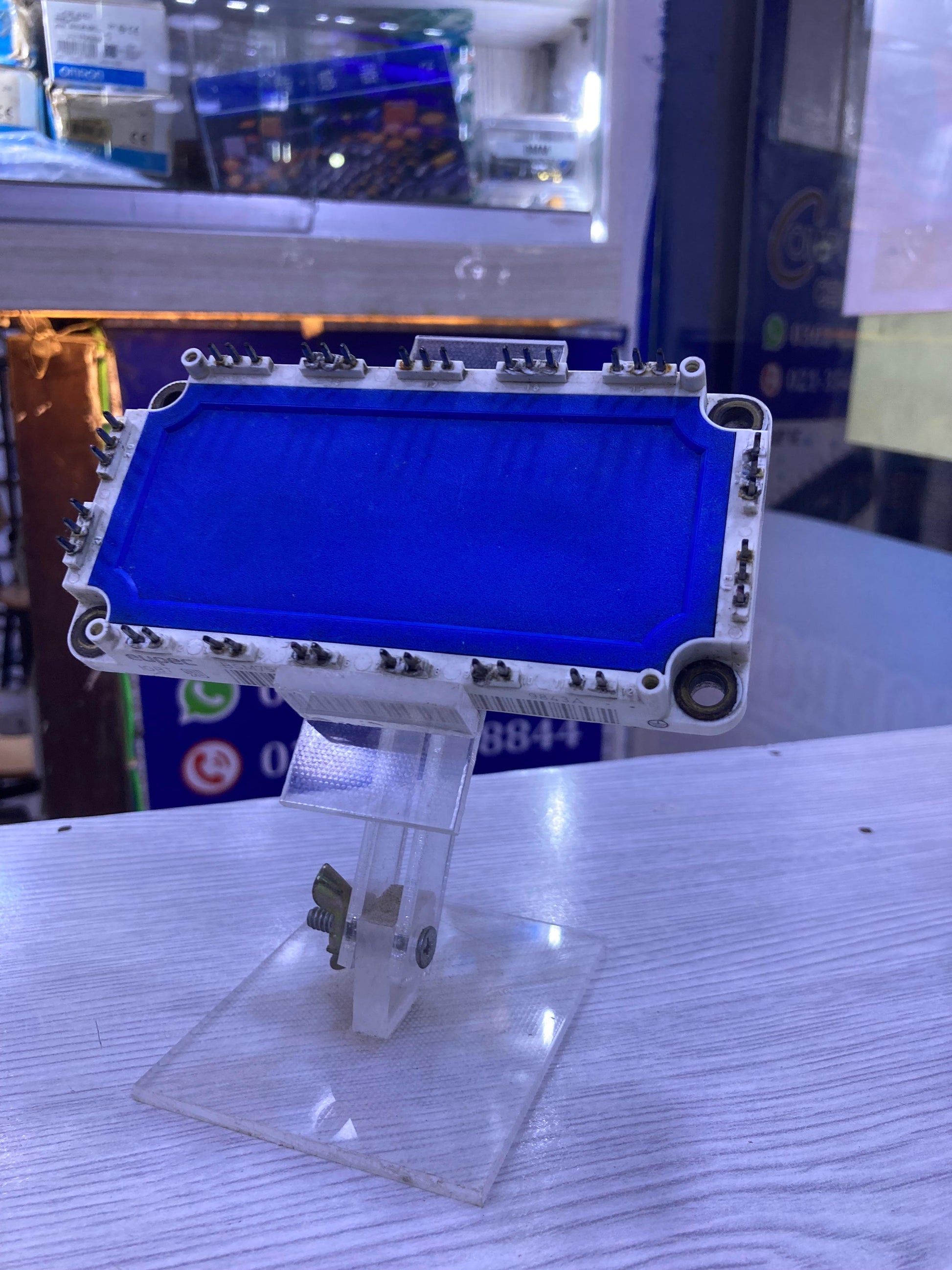 BSM75GD120DN2 electronic power module displayed on clear stand at The Component Centre
