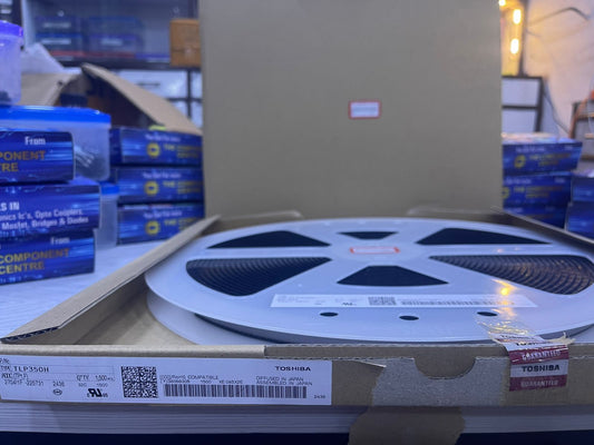 TLP350H electronic component reel from The Component Centre in a cardboard box with visible labels