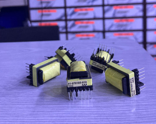 Electronic components labeled TX 41-070185-01G from The Component Centre displayed on a table