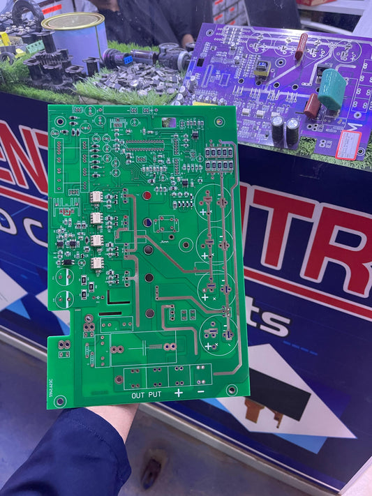 Green printed circuit board held by hand for 5KVA power supply from The Component Centre