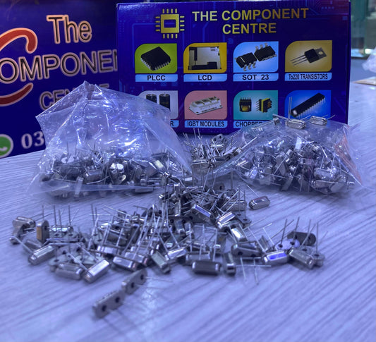 7.3728 electronic crystal oscillator components from The Component Centre in plastic bags on a table