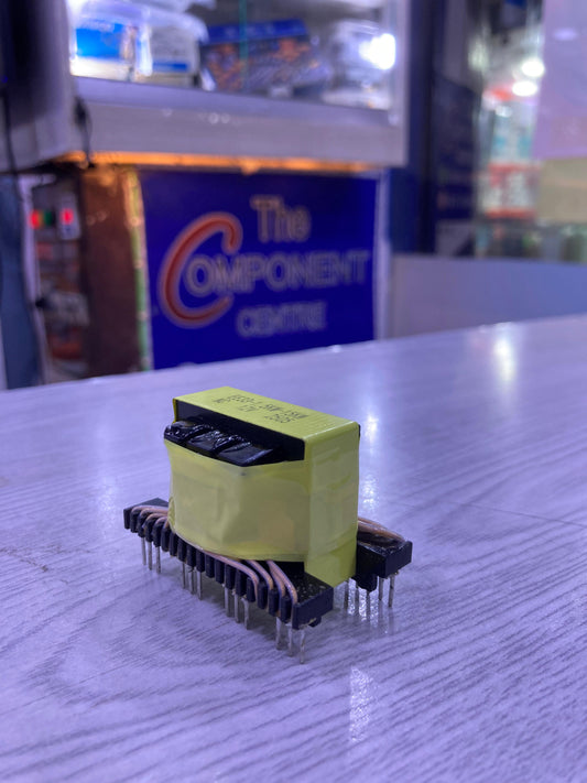 EE33-1.5-15KW electrical transformer component wrapped in yellow tape on a wooden surface