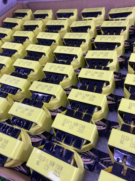 The Component Centre EE33-1.5-15KW yellow electrical components arranged in multiple rows