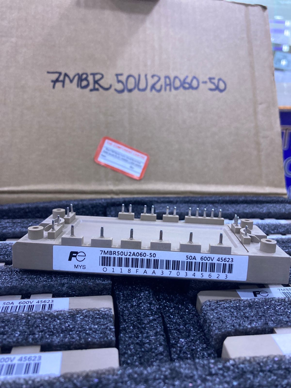 7MBR50U2A060-50 IGBT Module displayed on a packing foam with product label visible