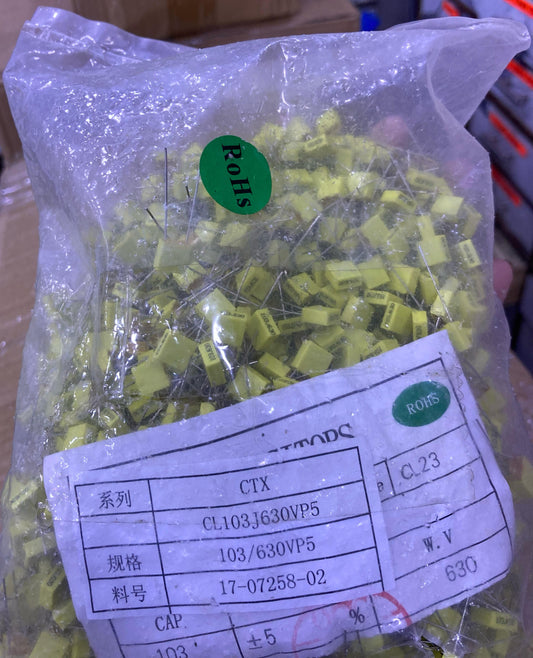 Bag of yellow 104J100 0.1uF capacitors with leads from The Component Centre