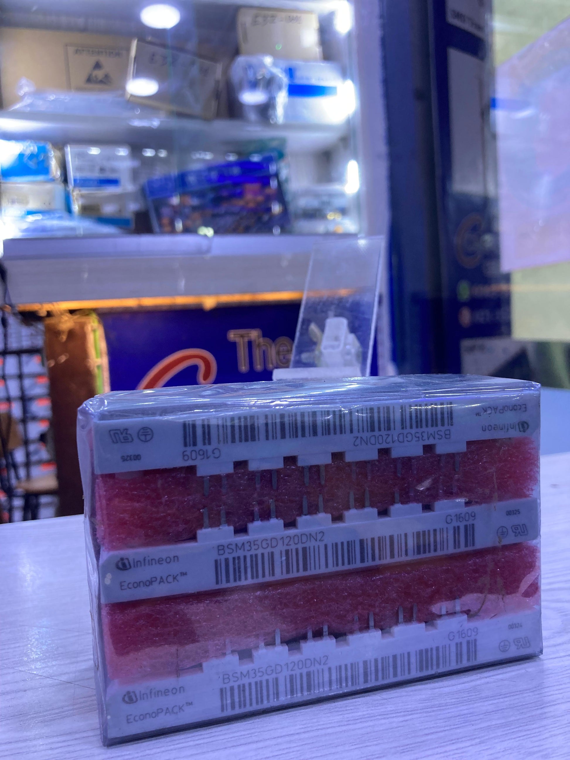 Box of Infineon BSM35GD120DN2 power modules packaged and stacked on a table by The Component Centre