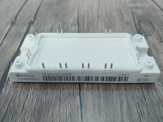 Infineon DDB6U104N16RR Power Module on a wooden surface with pins and label for electrical applications