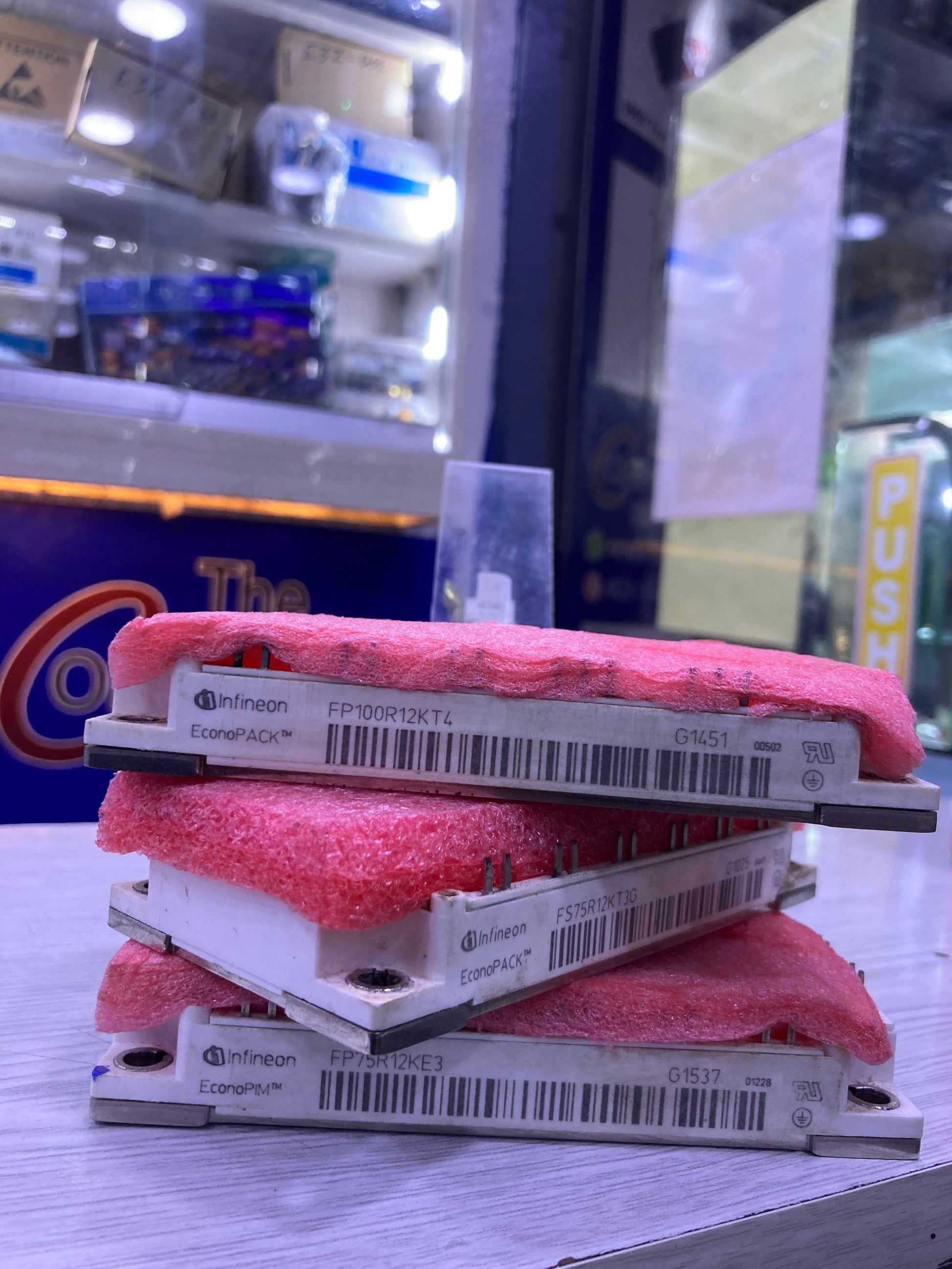 Infineon FP100R12KT4 power module with red protective foam from The Component Centre