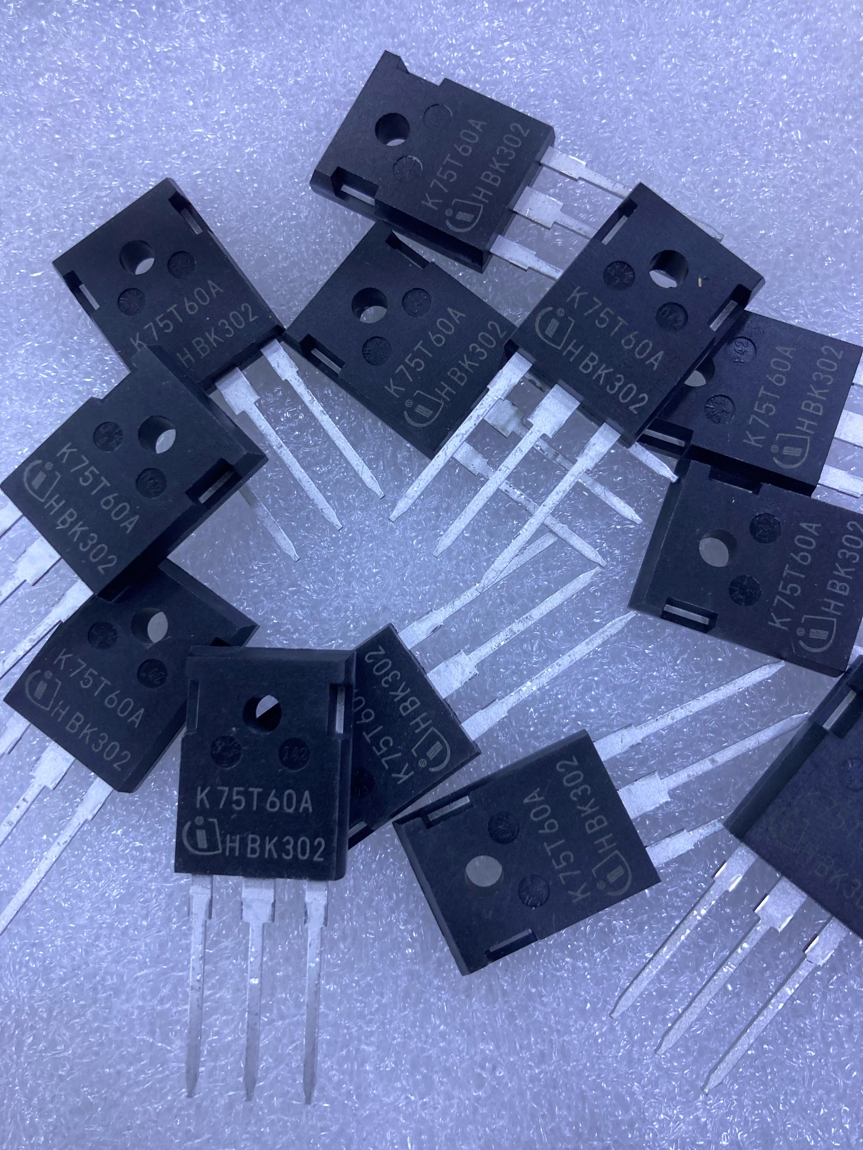 K75T60 electronic components from The Component Centre with three metal pins on a light surface