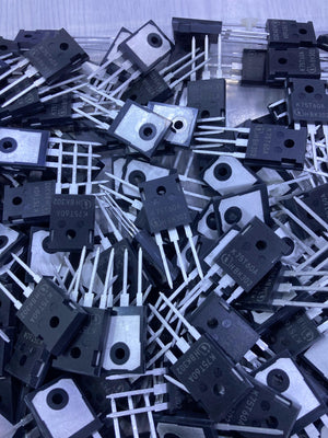 Pile of black K75T60 semiconductor transistors with three metal legs from The Component Centre