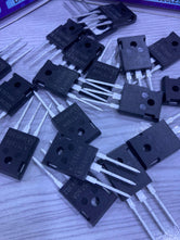 Multiple K75T60 electronic transistor components from The Component Centre on a wooden surface