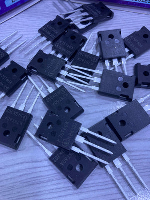 Multiple K75T60 electronic transistor components from The Component Centre on a wooden surface