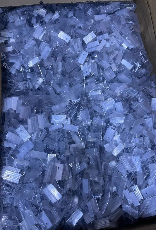 Bulk quantity of mini heat sink TO-220 components in a large container from The Component Centre