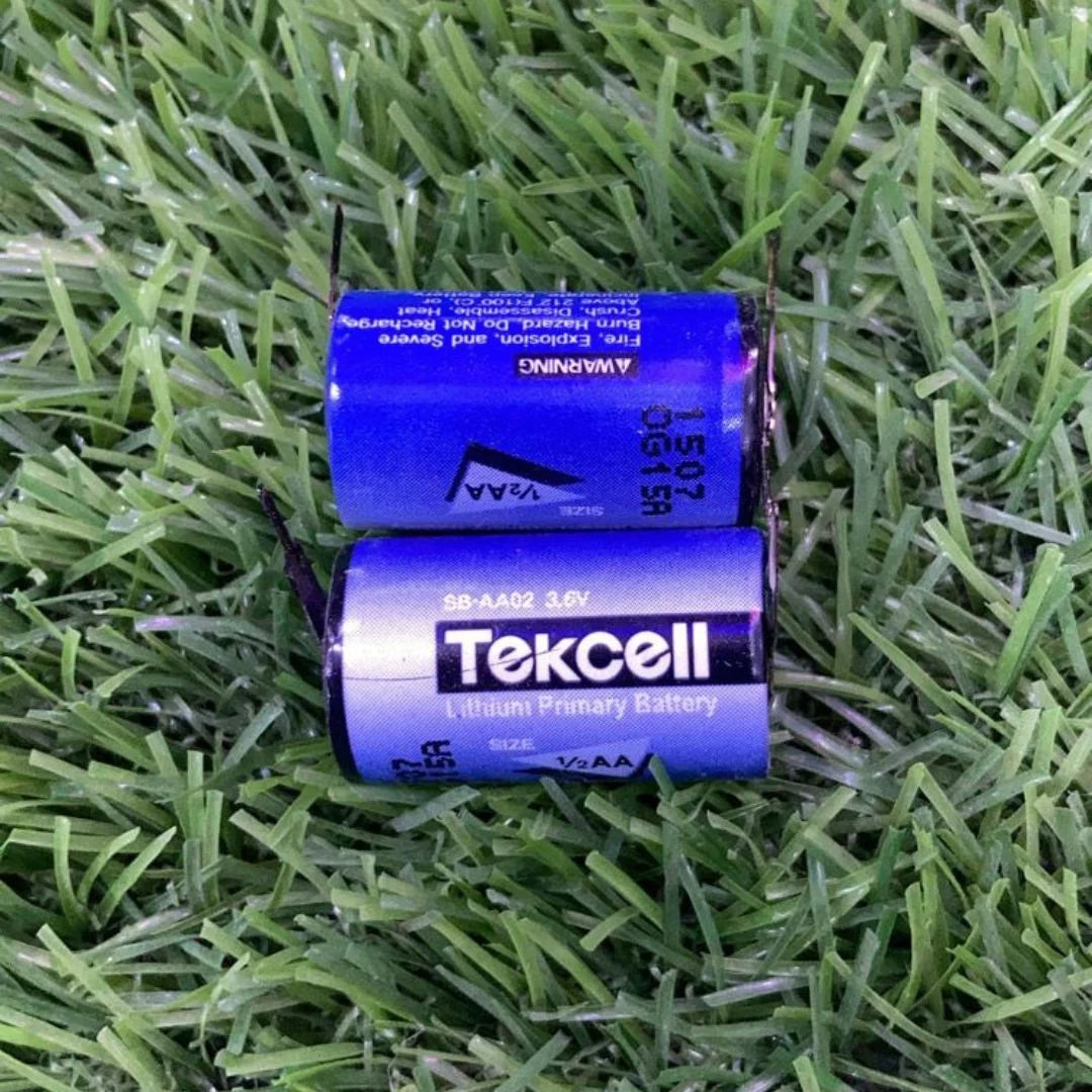 Tekcell SB-AA02 3.6V lithium primary batteries on green grass by The Component Centre