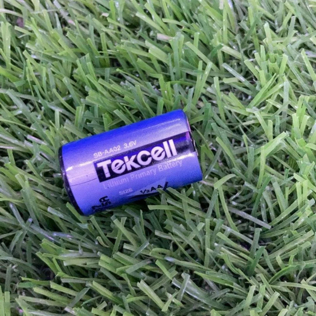 Tekcell SB-AA02 3.6V lithium primary battery on green artificial grass by The Component Centre