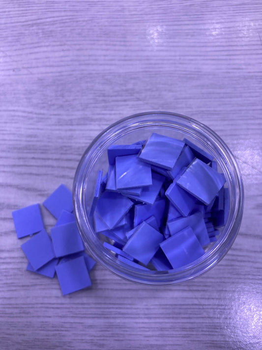 Jar of blue Pre-Cut Thermal Silicone Pads square pieces for electronics heat transfer and cooling