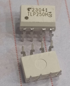 TLP250 electronic component with multiple pins from The Component Centre shown on paper background