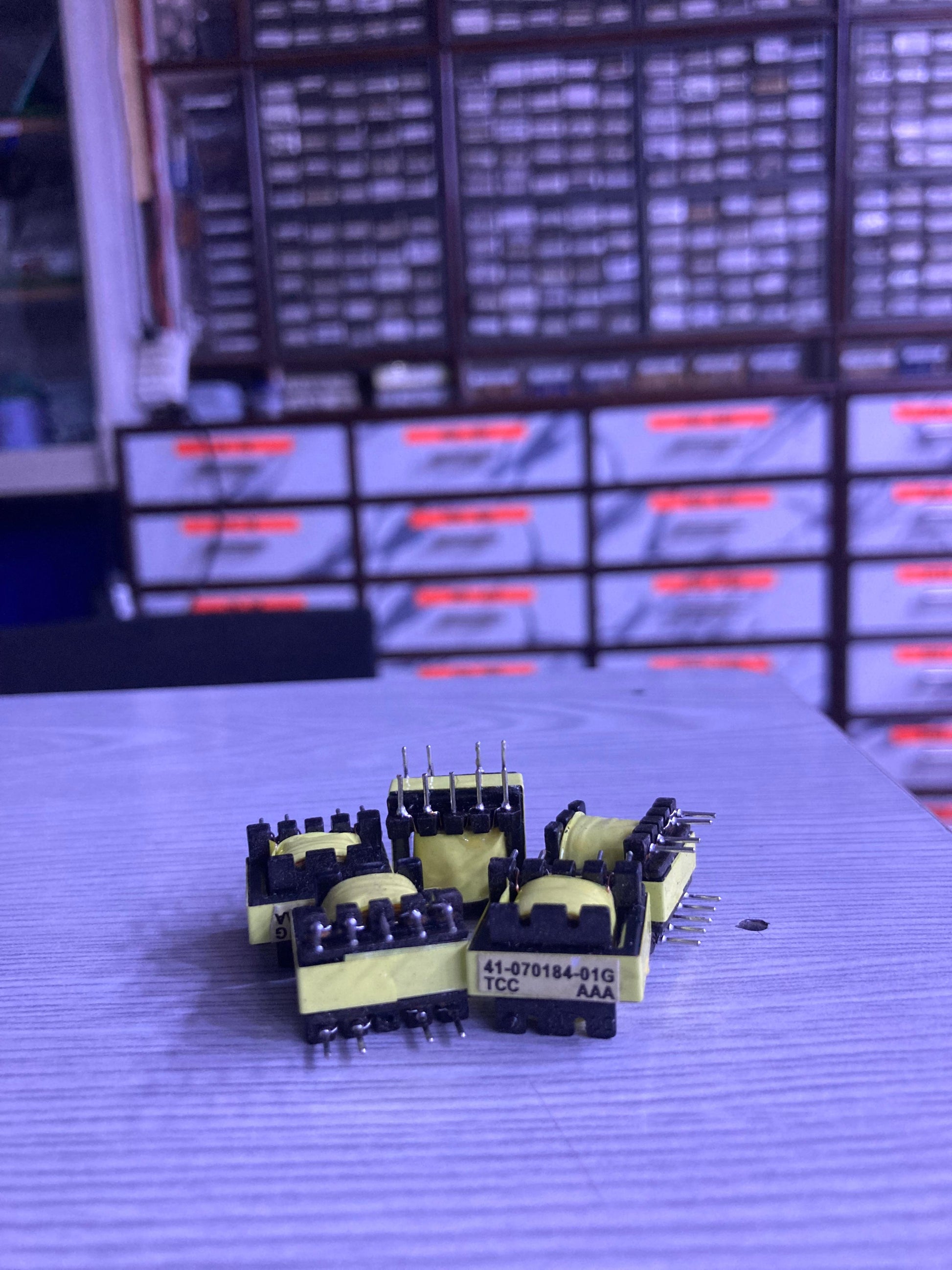 TX 41-070184-01G electronic components with multiple pins displayed on a table from The Component Centre